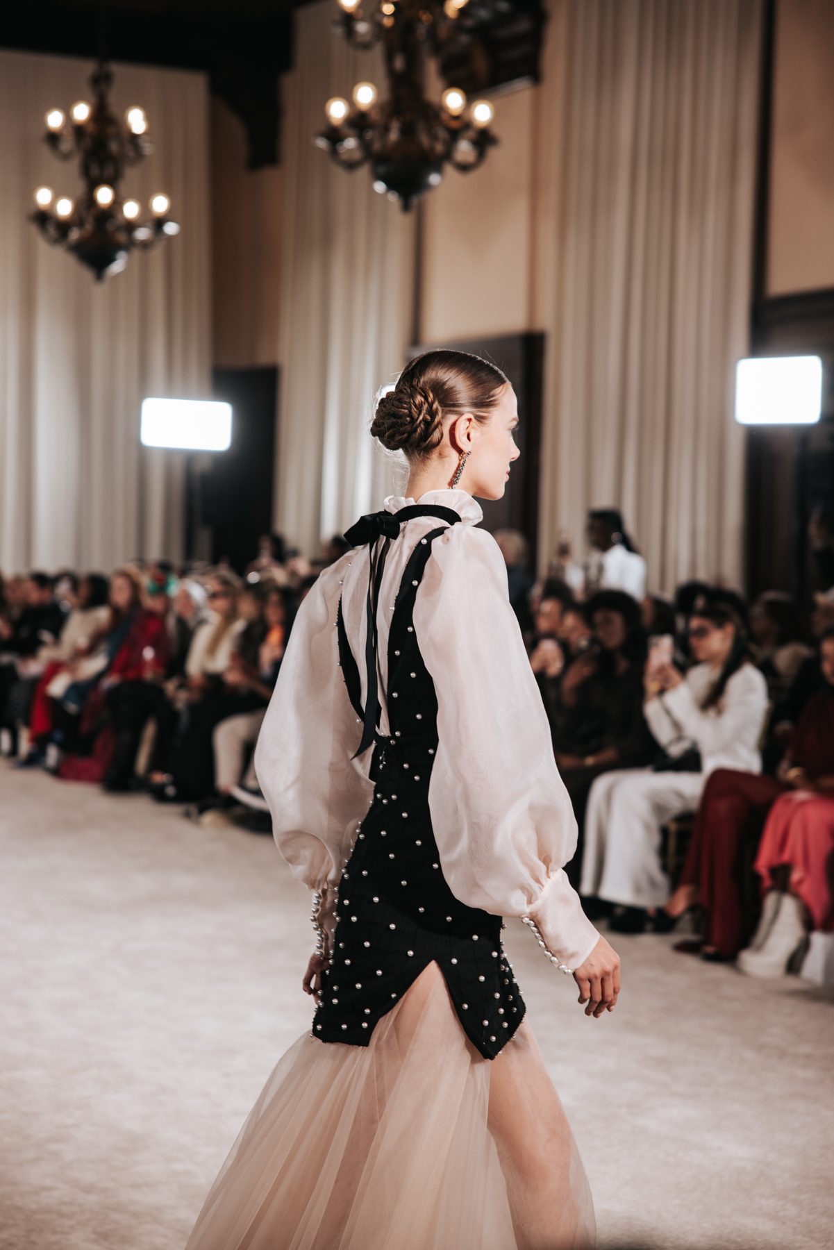 Runway model with braided updo at New York Fashion Week, Nardos show
