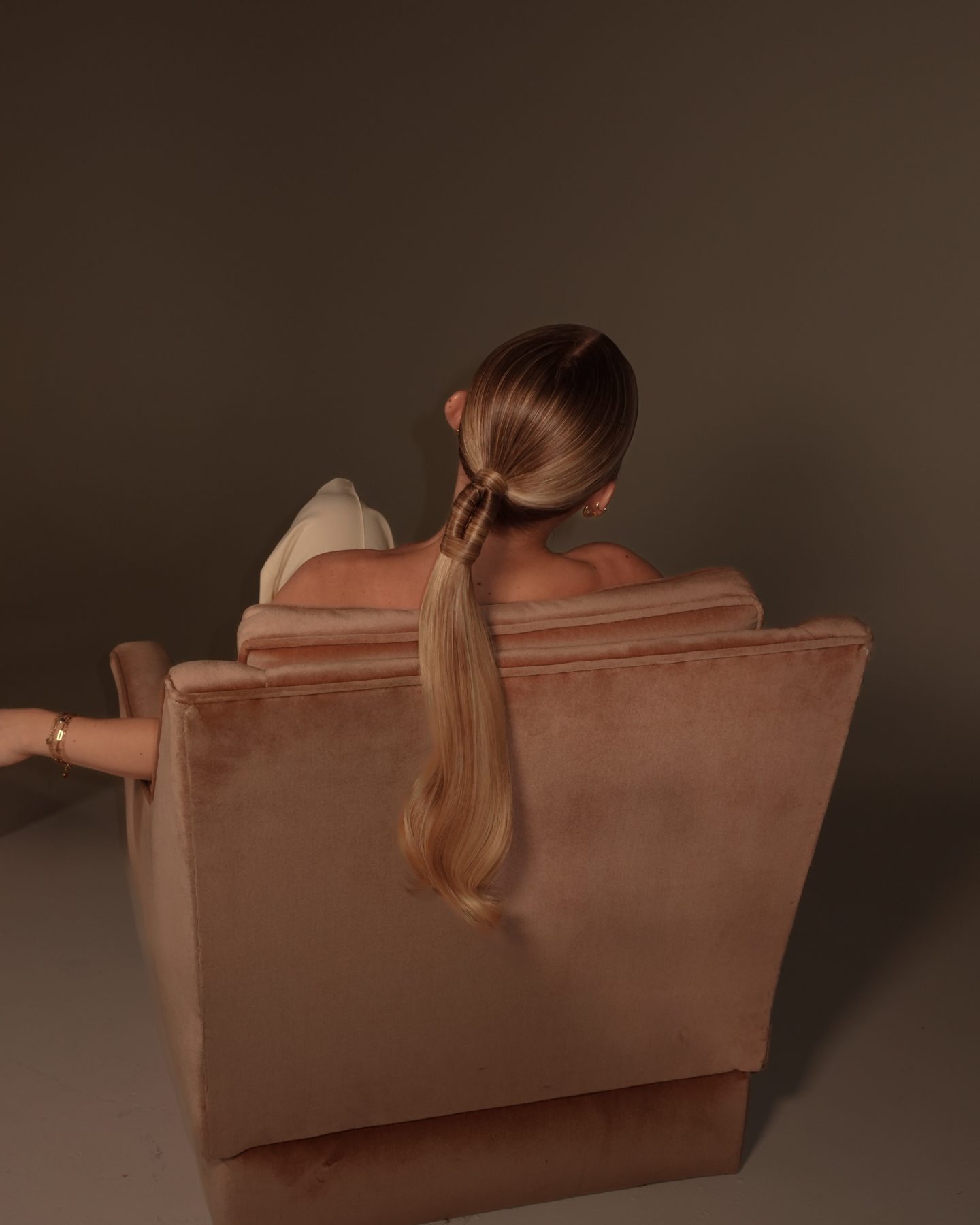 Sleek low ponytail, editorial studio portrait