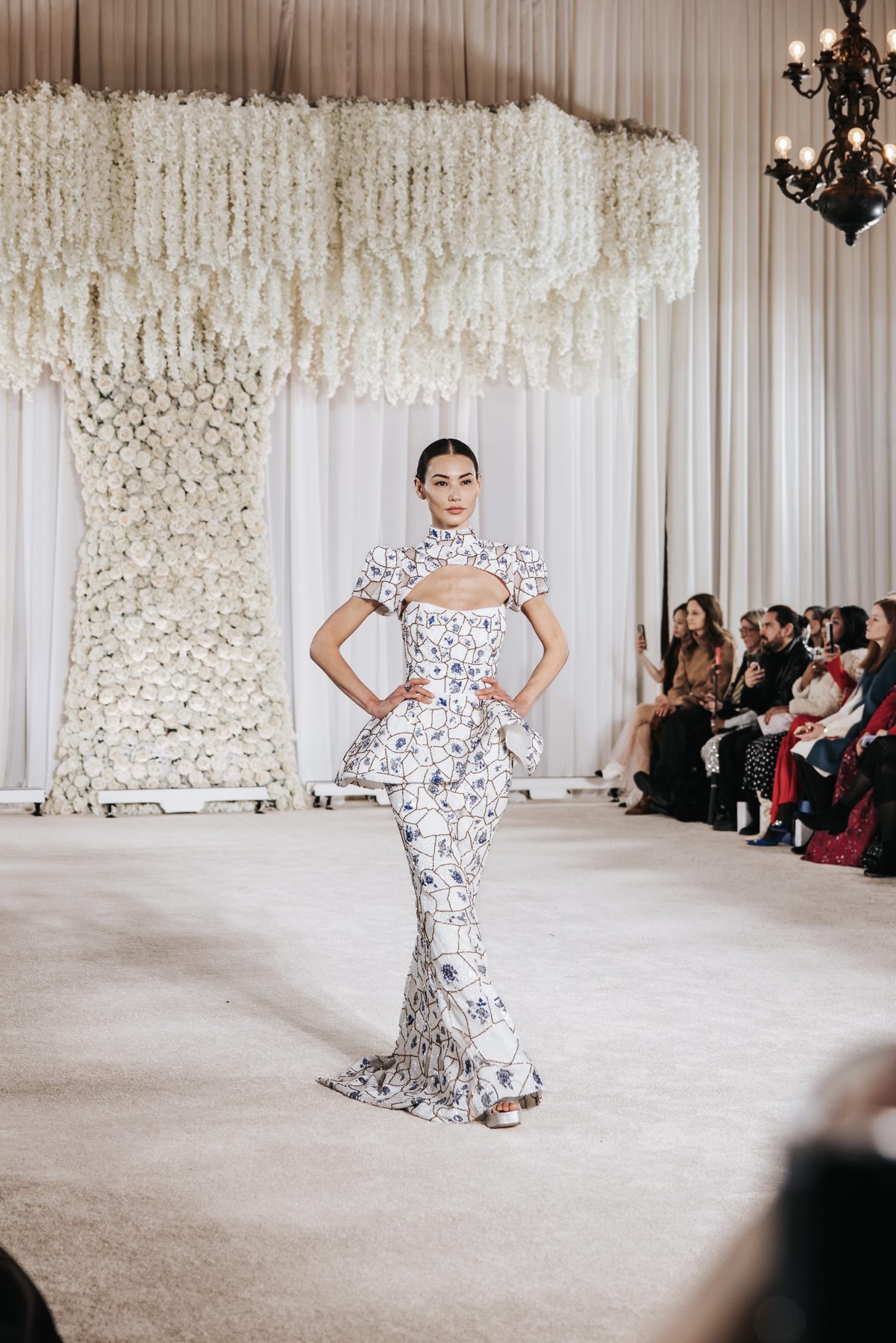 Runway model in sequined gown with sleek center-part hair, Nardos NYFW show