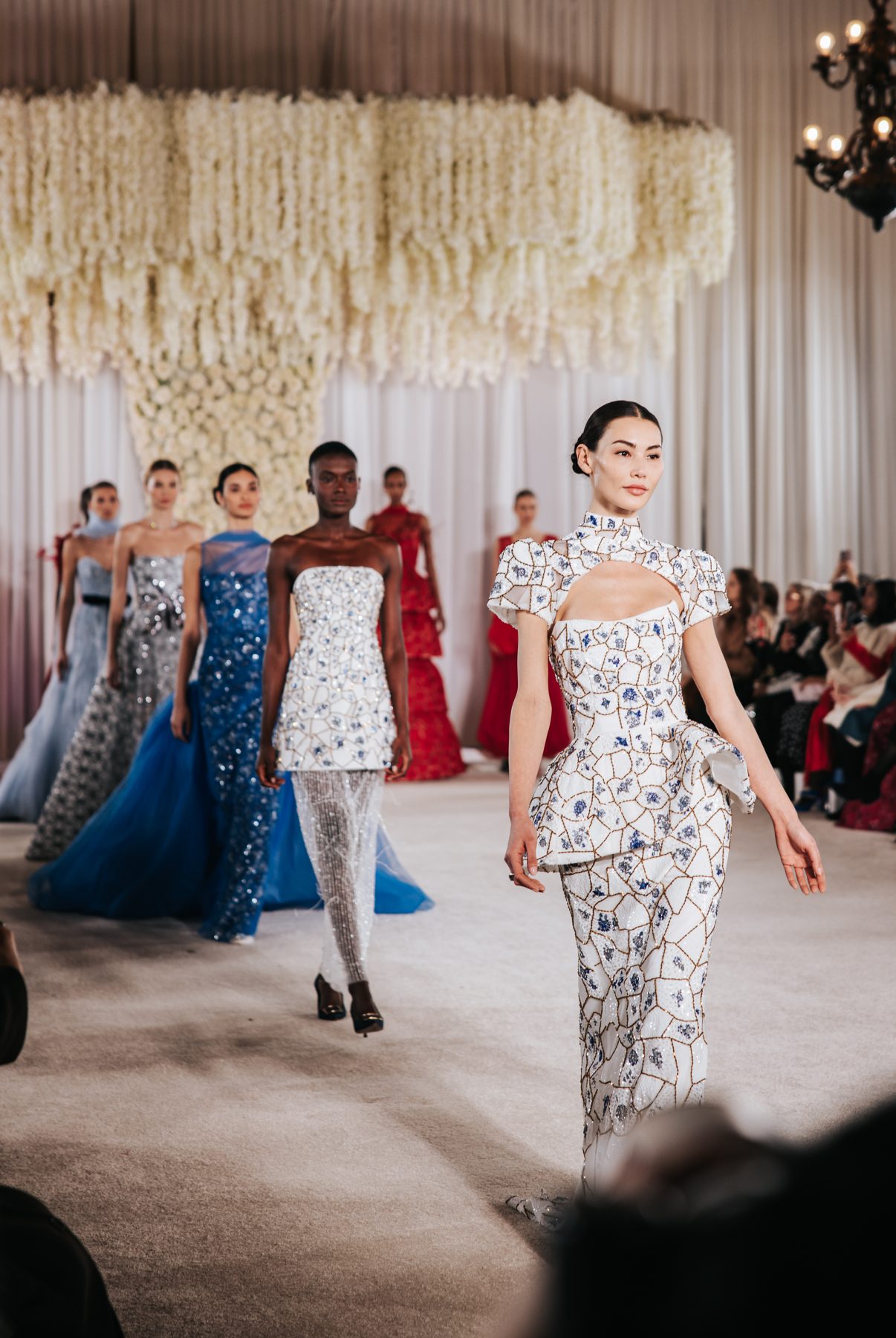 Runway lineup of models in sequined gowns, Nardos NYFW show
