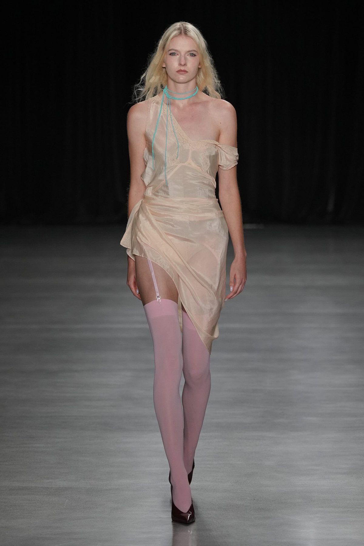 Runway model in pale silk dress with teal choker, Christian Cowan Spring 2027 show