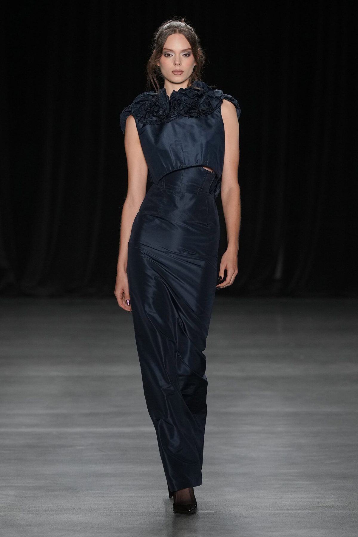 Runway model with half-up braided style in navy gown, Christian Cowan Spring 2027 show