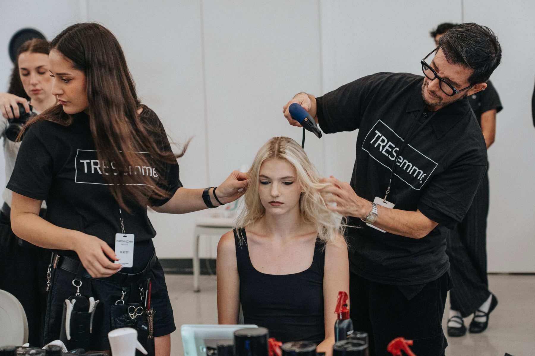 Hair team styling a model backstage, Christian Cowan Beauty, Spring 2027 show