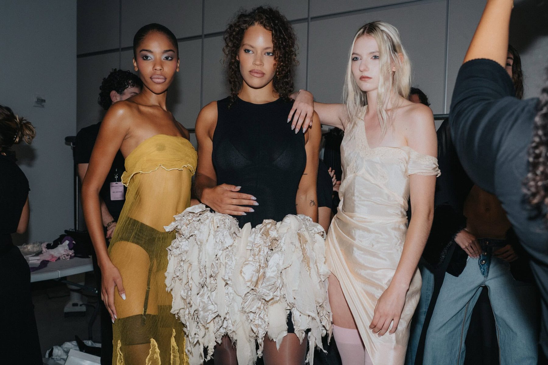 Three models backstage in varied looks, Christian Cowan Spring 2027 show