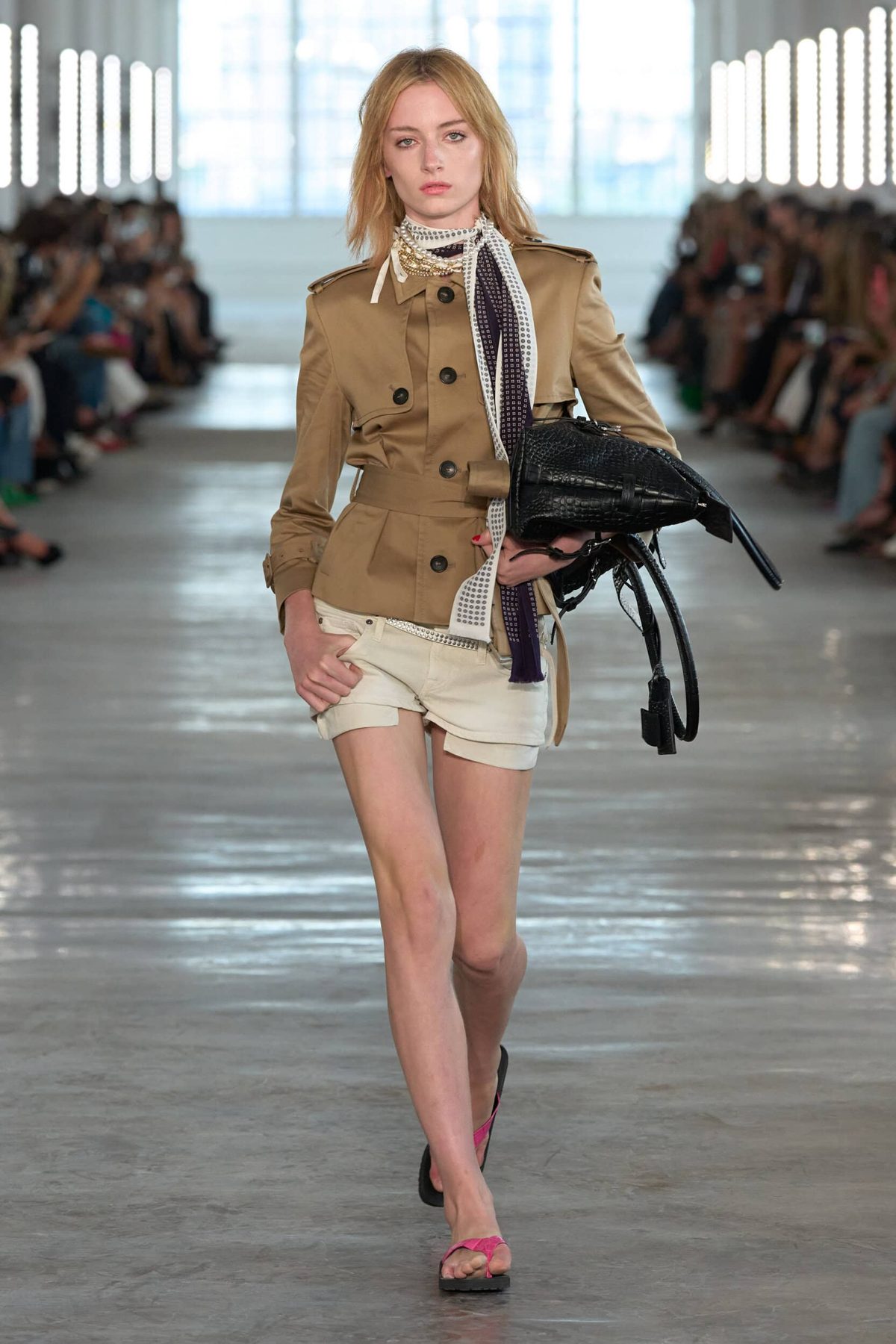 Runway model in trench jacket with sleek center-part hair, 7 For All Mankind Spring 2027 show